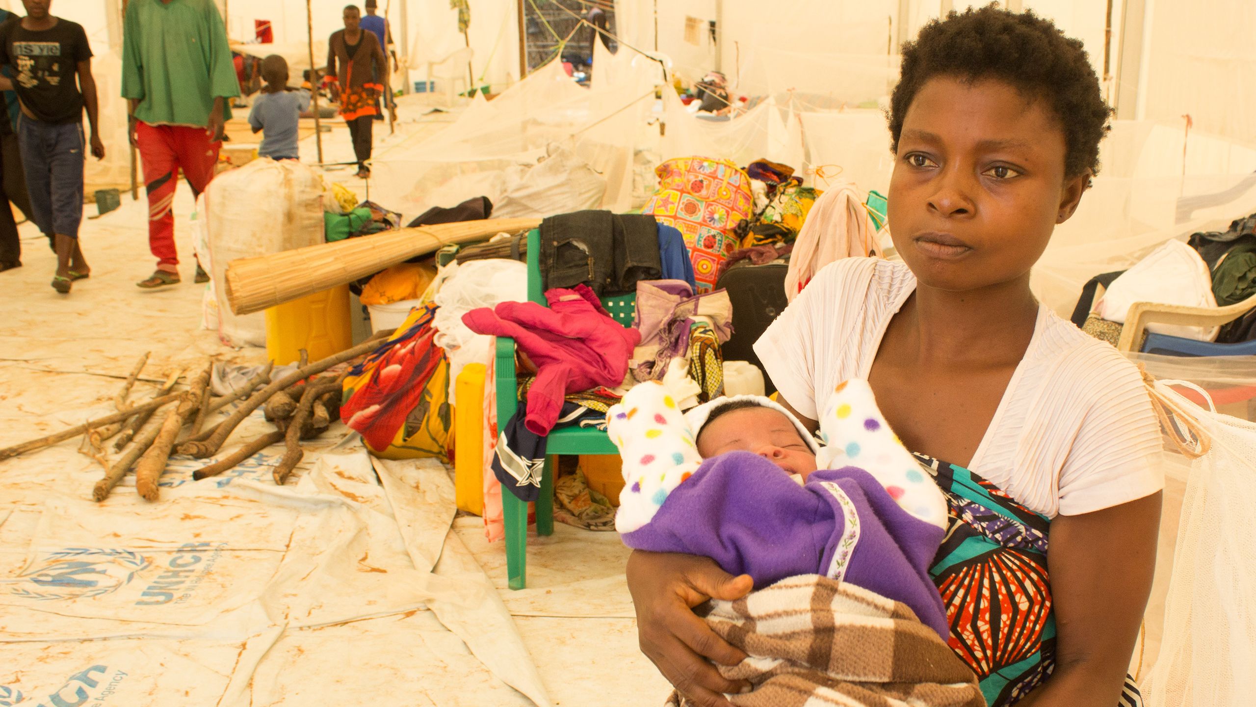 A mother and her child take refuge after intense fighting in the Democratic Republic of the Congo