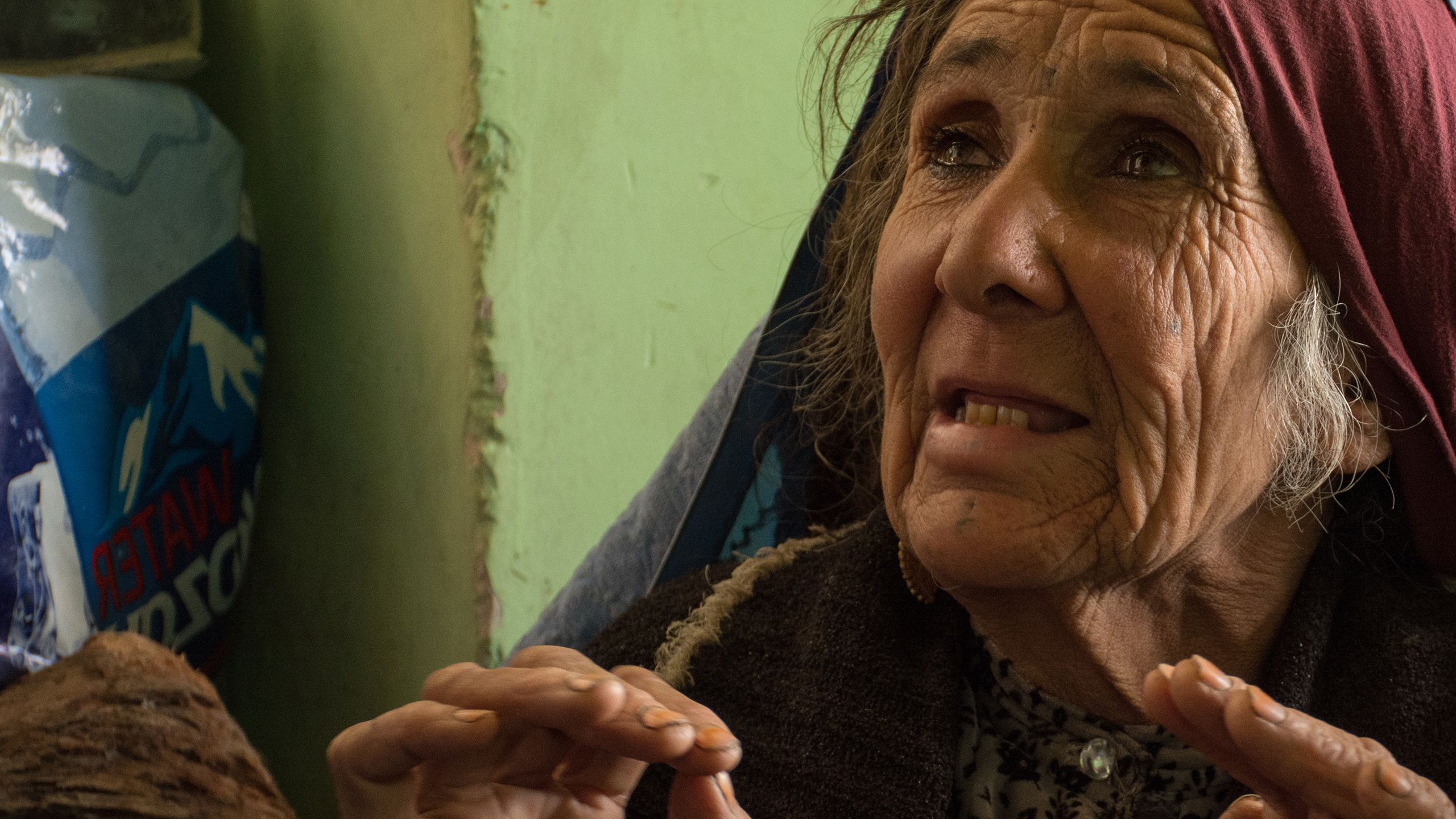 An old woman is seen after families from Tebar village live in Sar-e-Pol city after conflict left them displaced from their homes. Image by Enayatullah Azad, Norwegian Refugee Council, alert 199 Afghanistan.