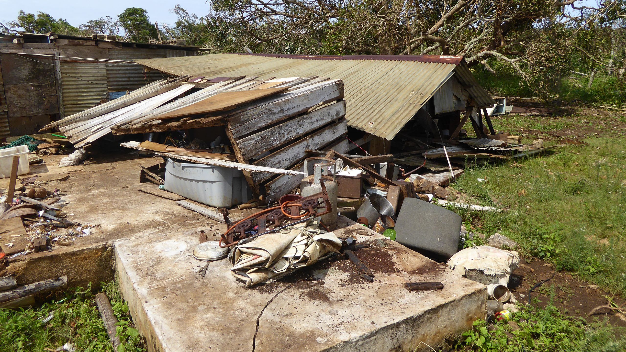 Homes are seen completely destroyed after they were hit with cyclone Gita in Tonga. Image by Bill Flinn, CARE UK, alert 217 Tonga.